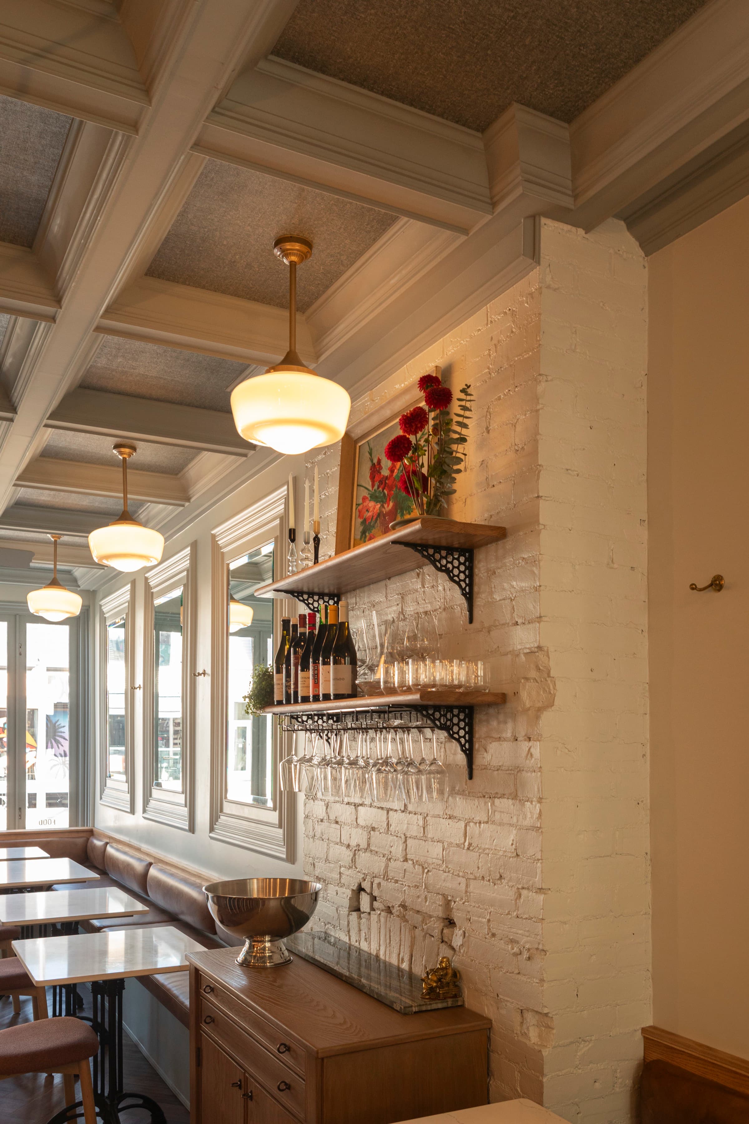 Bar Eugenie — coffered ceiling with fabric acoustic panels and pendant lights